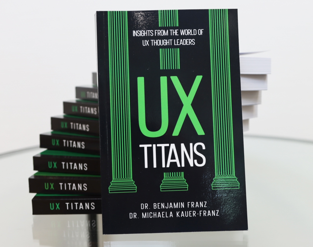 A stack of UX Titans books